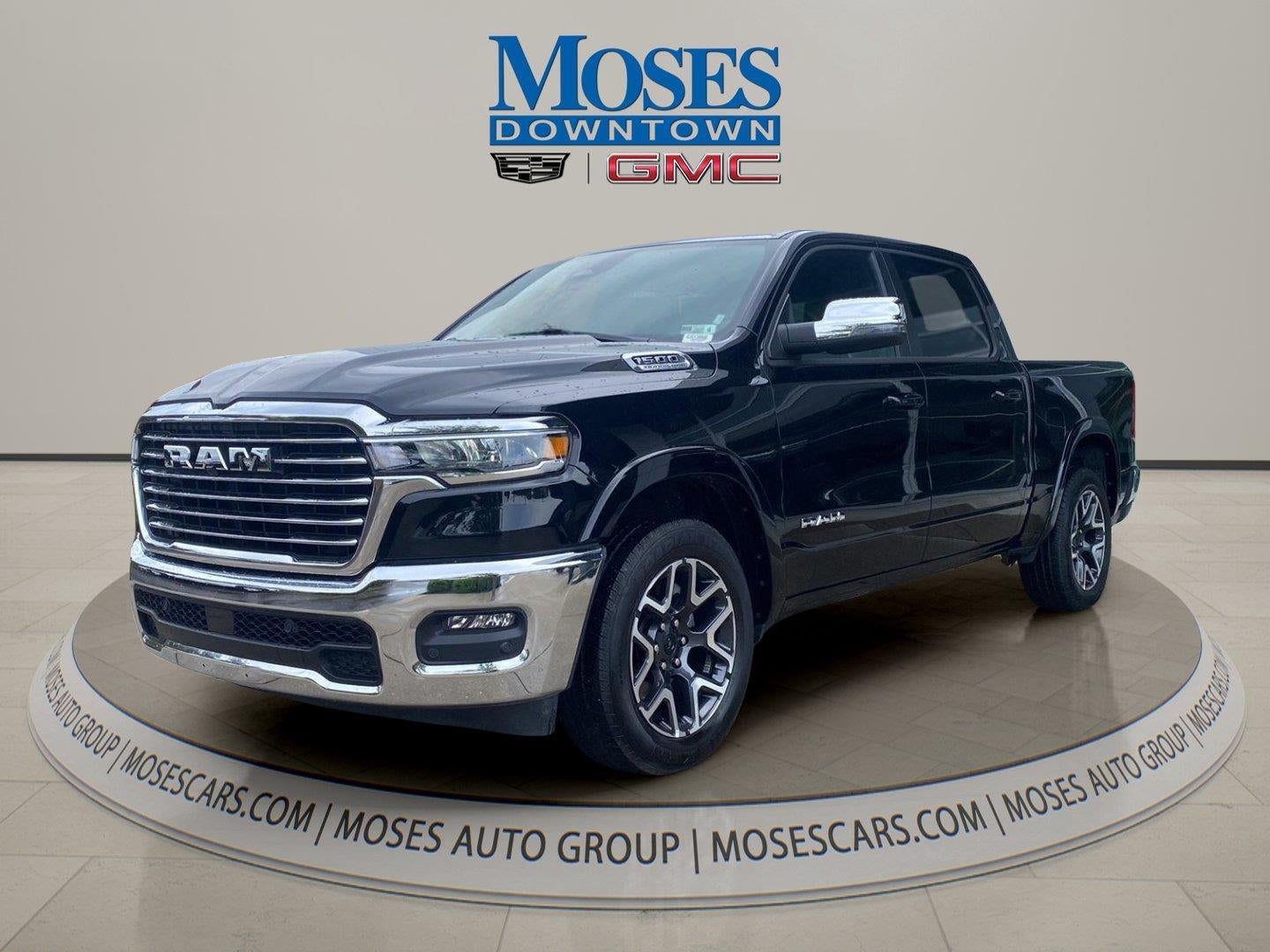2026 RAM 1500 Laramie Crew Cab 4x4 5'7" Box in Black — front three-quarter view