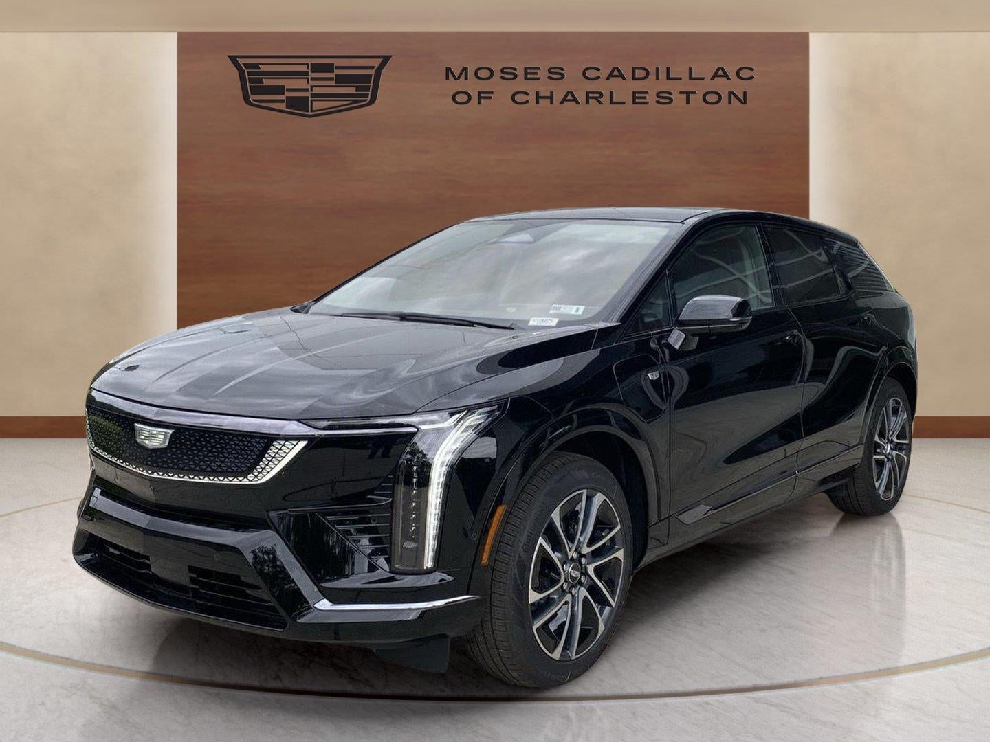 2026 Cadillac OPTIQ Sport in Black Raven — front three-quarter view