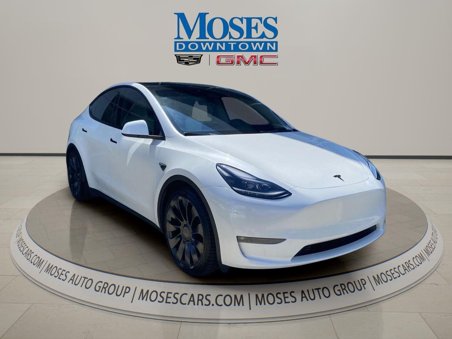 2024 Tesla Model Y Performance in White — front three-quarter view